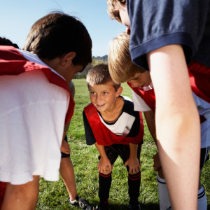 Young Soccer Team Huddling